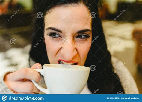 Mature Woman Biting Angrily At A Cup Of Coffee Stock Photo Image Of