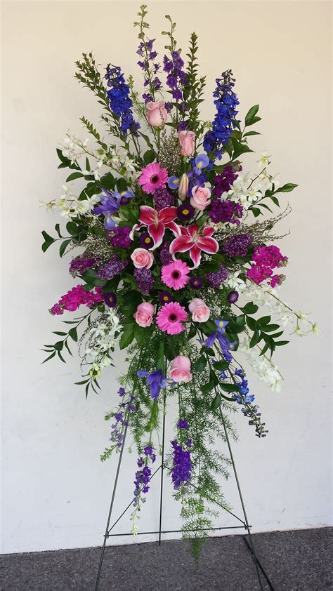 Our collection of blue and white sympathy tributes features flowers like roses, carnations, delphinium and elegant greenery. Standing Funeral Spray of Stargazer lilies, Blue ...