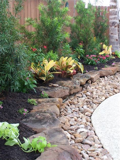 Layered Rock And Mulch Landscaping Courtyard Landscaping Landscaping