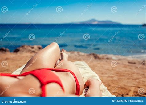 Woman Relaxing On Beach Lying On Chaise Longue With Sea And Mountain View Summer Vacation