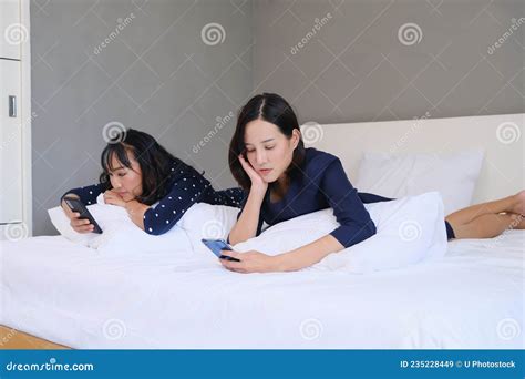 Two Asia Woman Relax In Room Playing Smart Phone Stock Image Image Of Couple Journey 235228449