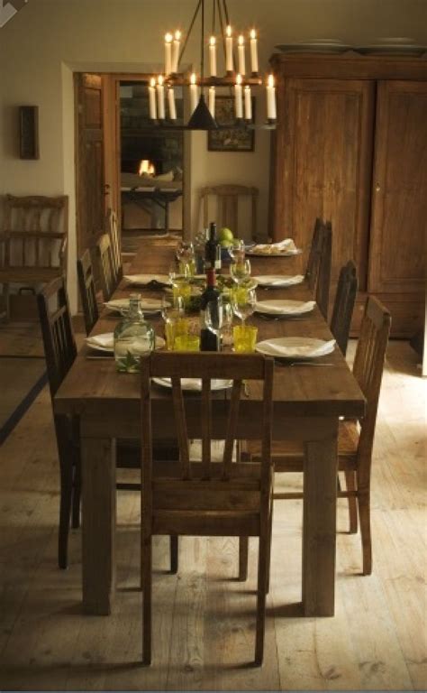 It's where friends gather for birthdays, holidays and dinner parties. Love love love the farmhouse table and mismatched chairs ...