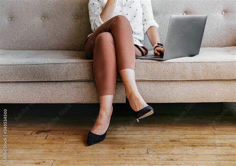 Woman Sitting With Crossed Legs Stock Photo Adobe Stock