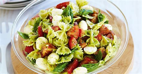 Fresh and easy pasta salad packed with crisp vegetables, fresh mozzarella, and tossed with a simple dressing. Caprese-style pasta salad