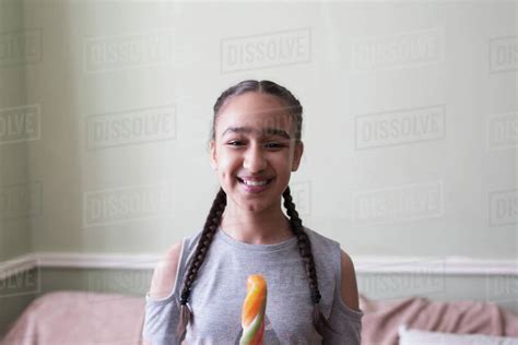 Portrait Smiling Confident Tween Girl Eating Flavored Ice Stock