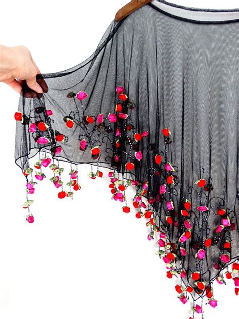 Watch the latest video from kanupriya gupta (@kanupriyagupta). It's Raining Roses Fringe Beaded Sheer Poncho // Boho ...