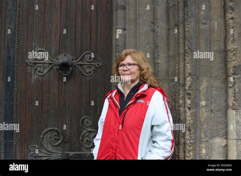 Mature Irish Woman Expressions Portrait Against An Ancient Building