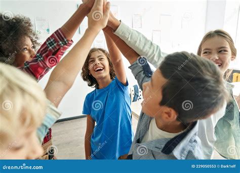 Happy Diverse Kids School Students Group Giving High Five Together In