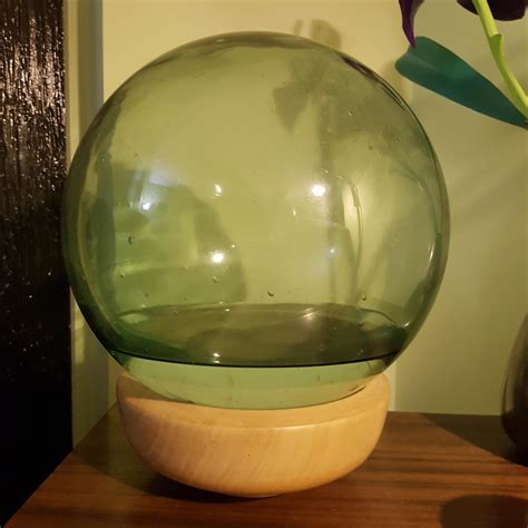 This Decorative Glass Sphere Has No Openings But Has Accumulated The Water Inside Over The Last
