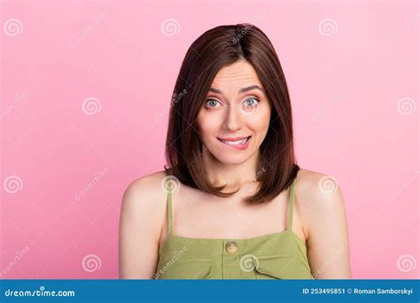 Photo Of Shy Brunette Lady Bite Lip Wear Khaki Top Isolated On Pink