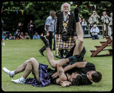 scottish backhold wrestling highland games men in kilts wrestling