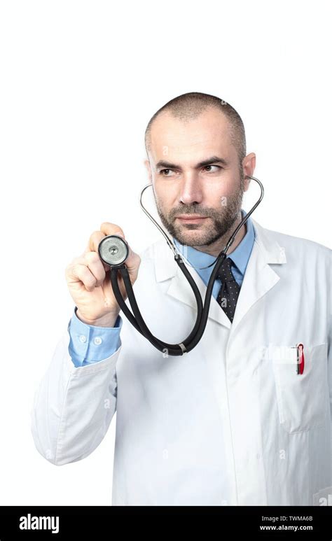 Portrait Isolated On White Of A Doctor Obscuring With A Stethoscope