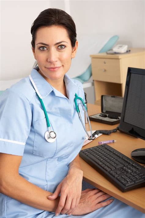 British Nurse Sitting At Desk At Work Stock Image Image Of Relaxed