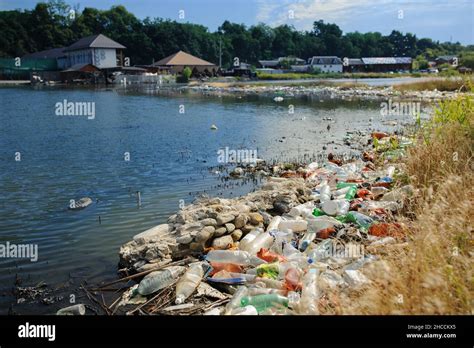 The Lake And The Shore Are Littered With The Garbage Stock Photo Alamy