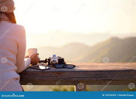Smiling Asian Woman Drinking Coffee And Tea And Take A Photo And Relax In Sun Sitting Outdoor In