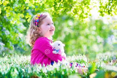 Little Girl Playing With A Rabbit Stock Image Image Of People