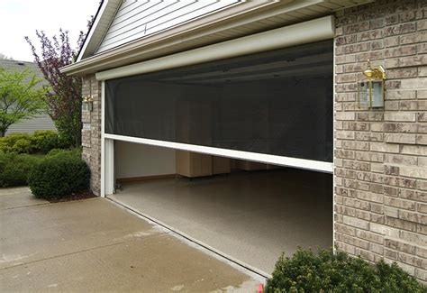 Keep fresh air in and pests out with this heavy duty double garage door screen! The Benefits of a Garage Door Screen | R&S Erection of Concord