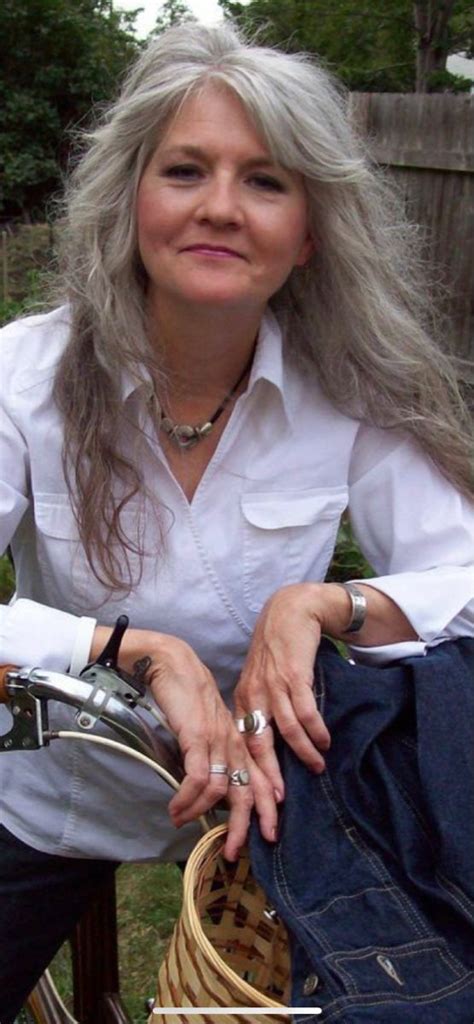 silver layers in 2023 grey hair with bangs long hair older women long gray hair