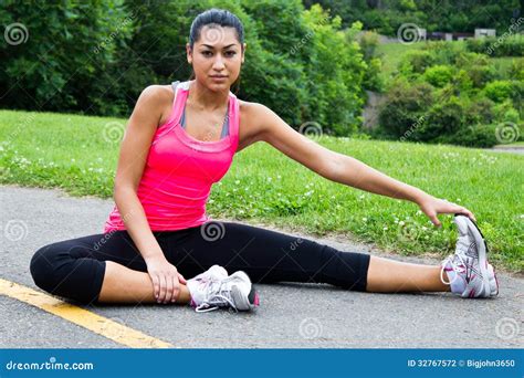 Young Woman Stretches Before Jogging Stock Photo Image Of Exercise