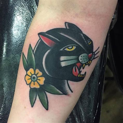 Panther is a wild and mysterious creature which live in the deep secrets of jungles and drive fear into the hearts of other animals and human beings. Traditional panther head tattoo on the inner forearm.
