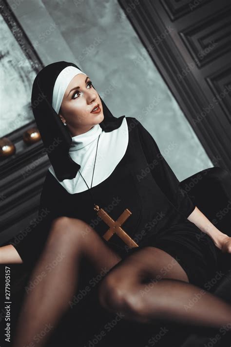 Sexy Nun Prays Indoor Beautiful Babe Holy Babe Babe Beautiful Nun With A Cross In A Robe