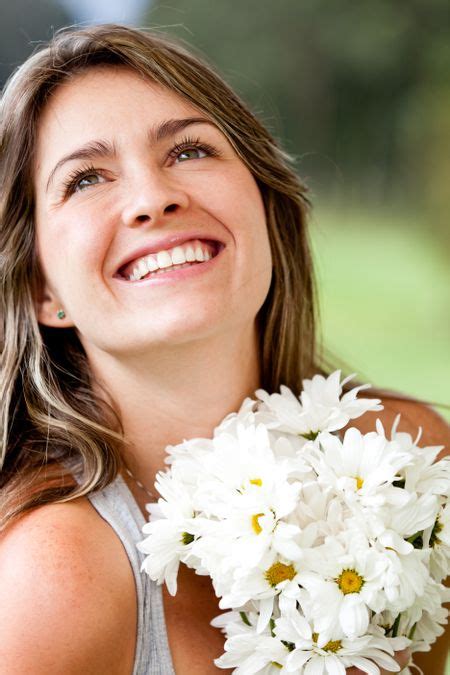 Happy Woman Smiling With A Bunch Of Flowers Freestock Photos