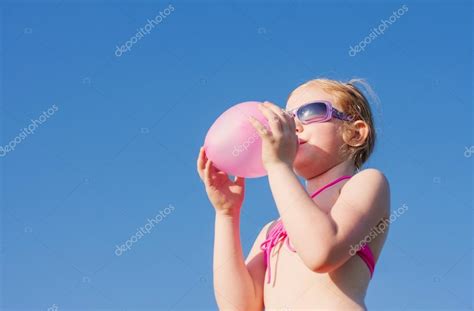 Girl Inflating Balloon Stock Photo By Kruchenkova
