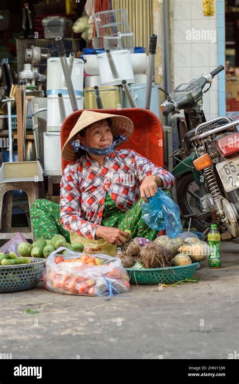 a mature vietnamese woman sells her produce at the busy morning food market in cai rang near