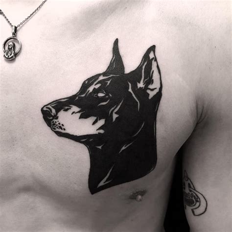 Black Doberman Tattoo Inked On The Left Side Of The Chest Done At Bk