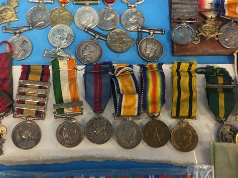 A Box Of Assorted Miniature Military Service Medals 4 Mounted On Bars