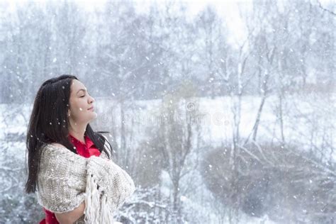 Brunette Woman Enjoying The Snowfall Stock Image Image Of Cold