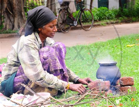 Image Of Indian Old Woman Cooking In A Traditional Way Re646329 Picxy