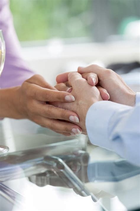 Two People Holding Hands For Comfort Stock Image Image Of Consoling