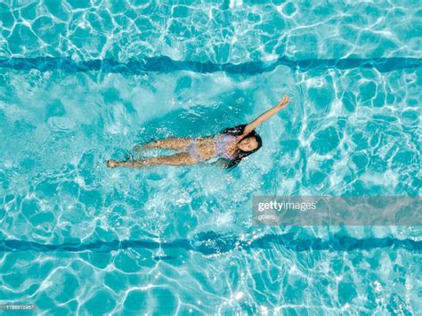 Drone View On Teenage Girl In Swimming Pool High Res Stock Photo