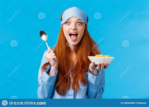 Excited Overwhelmed Happy Redhead Caucasian Woman Eating Cereals