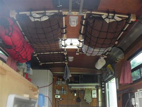 Two Cargo Nets Are Attached To A Tiny Trailers Ceiling And Storing