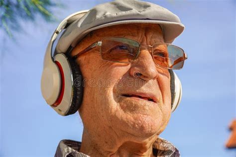 Vitality Senior Citizen Listening Music With Headphones Mental Health
