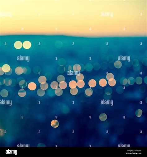 City Blurring Lights Abstract Circular Bokeh On Toned Blue Background