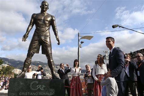 Portuguese footballer cristiano ronaldo stands near a bust of his likeness during a ceremony to rename. Cristiano Ronaldo Statue Erected in Portugal | Time