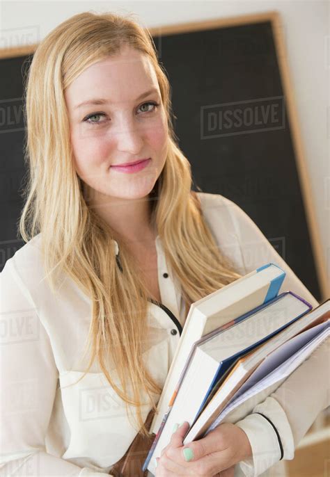 Portrait Of Young Woman In Classroom Stock Photo Dissolve