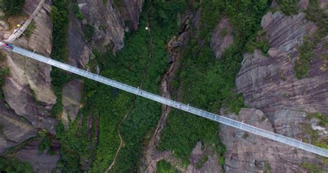 Glass Suspension Bridge Spans Between Two Cliffs In China