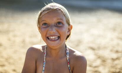 Portrait Of Girl Making Face On The Beach Stock Photo