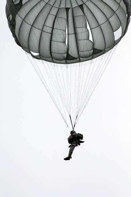 A Us Army Paratrooper Parachutes To The Ground Following Nara
