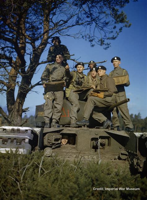 Squadron Leader Gives Instructions To Tank Commanders On The Turret Of