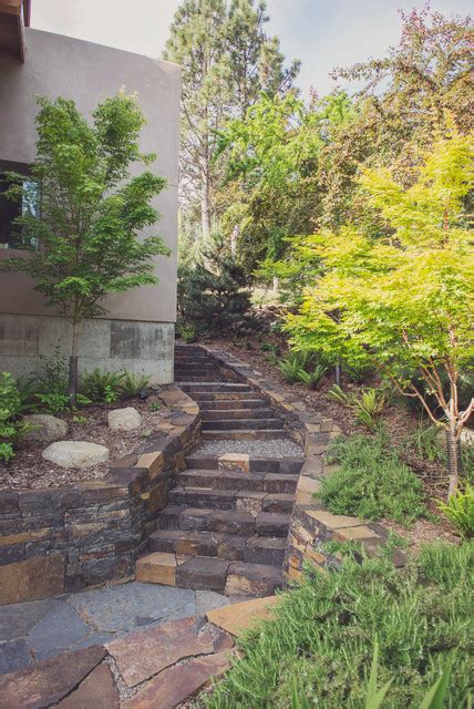 Ledgestone Staircase With Stacked Basalt Retaining Walls And Flagstone