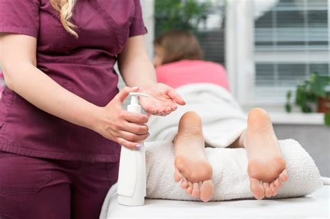 Premium Photo Foot Massage In The Spa Therapist Applying Pressure On Female Leg Masseur Does