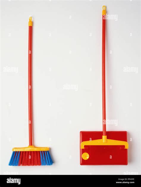 Two Colourful Brooms Stock Photo Alamy