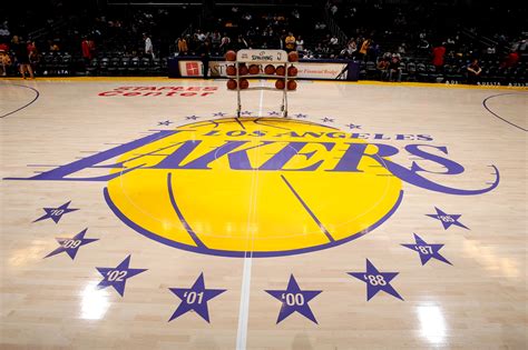 The los angeles lakers logo is shown at mid court before a game between the utah jazz and the los angeles lakers at staples center on october 13,. Charitybuzz: 2 Courtside Seats for Lakers-Wizards at STAPLES Center, J... - Lot 689400