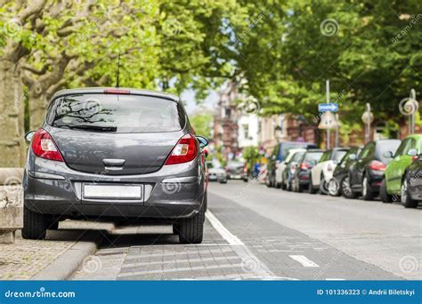 Rows Of Cars Parked On The Roadside In Residential District Stock Image
