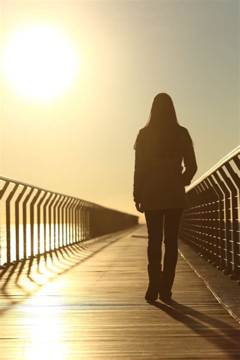 Sad Woman Silhouette Walking Alone At Sunset Empowerteen